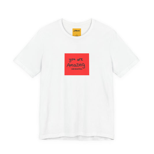 white t-shirt with a red square and text  reads you are amazing and beautiful on a white background