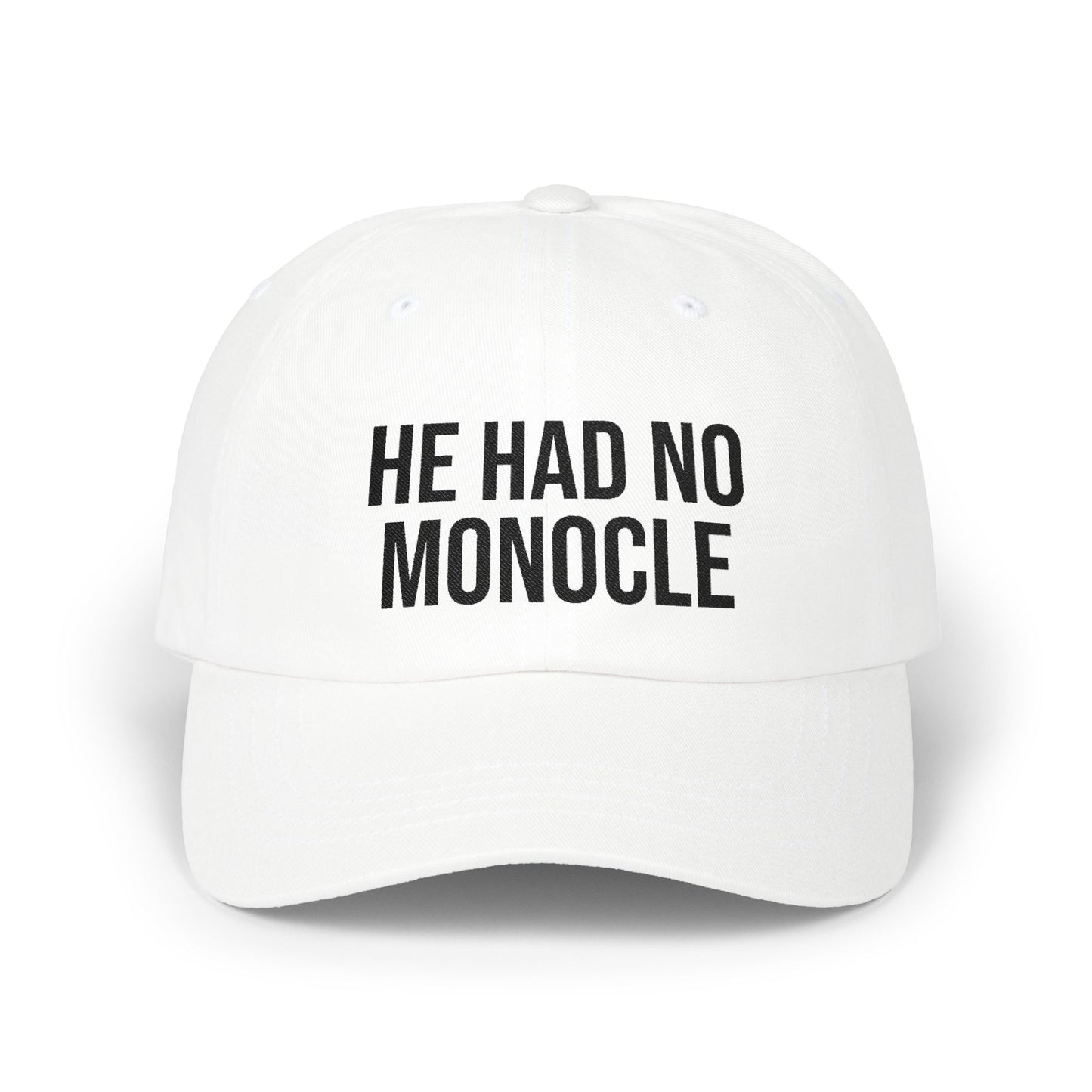 White cap with black text 'HE HAD NO MONOCLE' on a white background