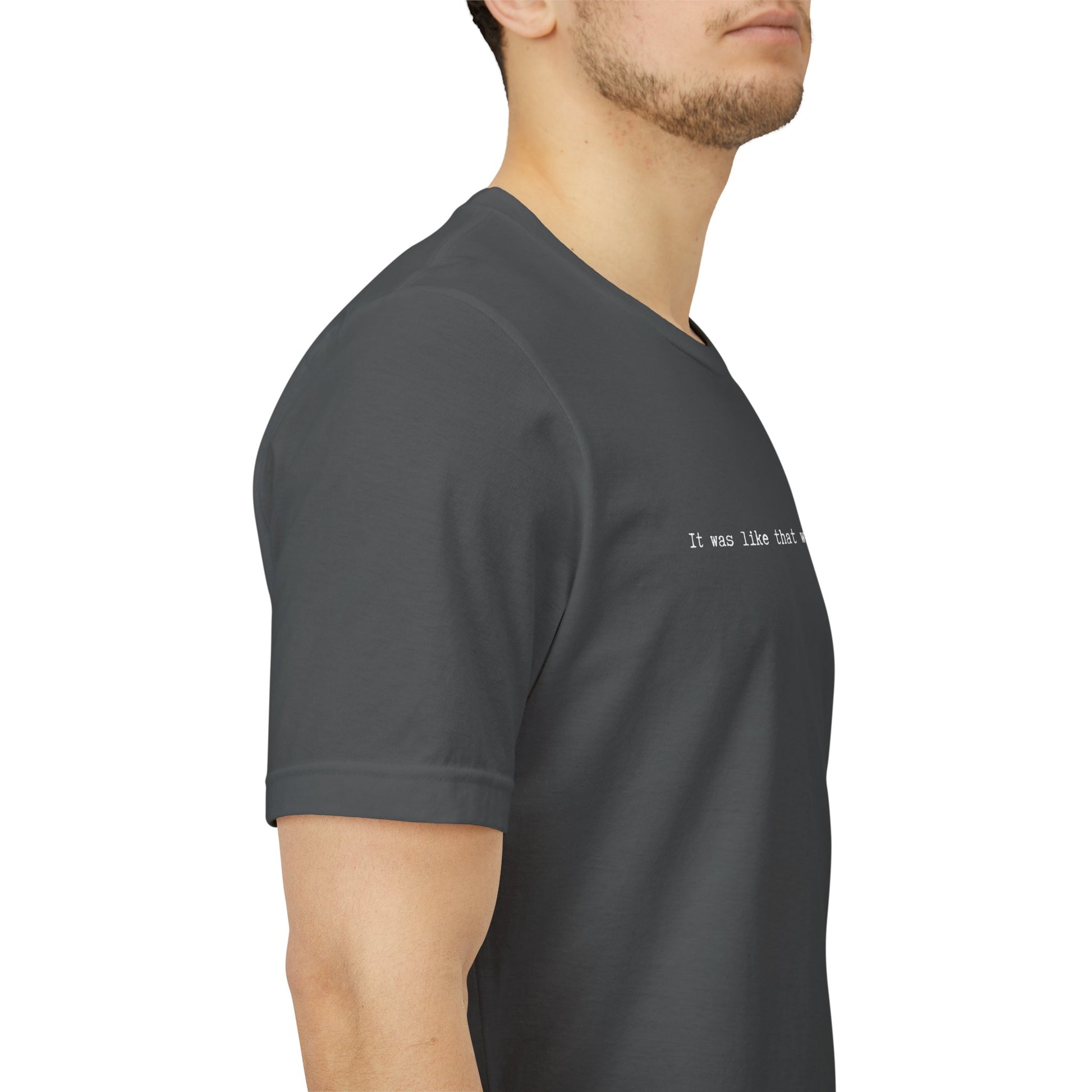 side view person wearing unisex t-shirt with white IT WAS LIKE THAT WHEN I GOT HERE text - funny sarcastic tee