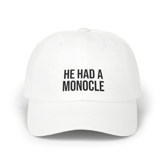 White cap with 'HE HAD A MONOCLE' text on a white background