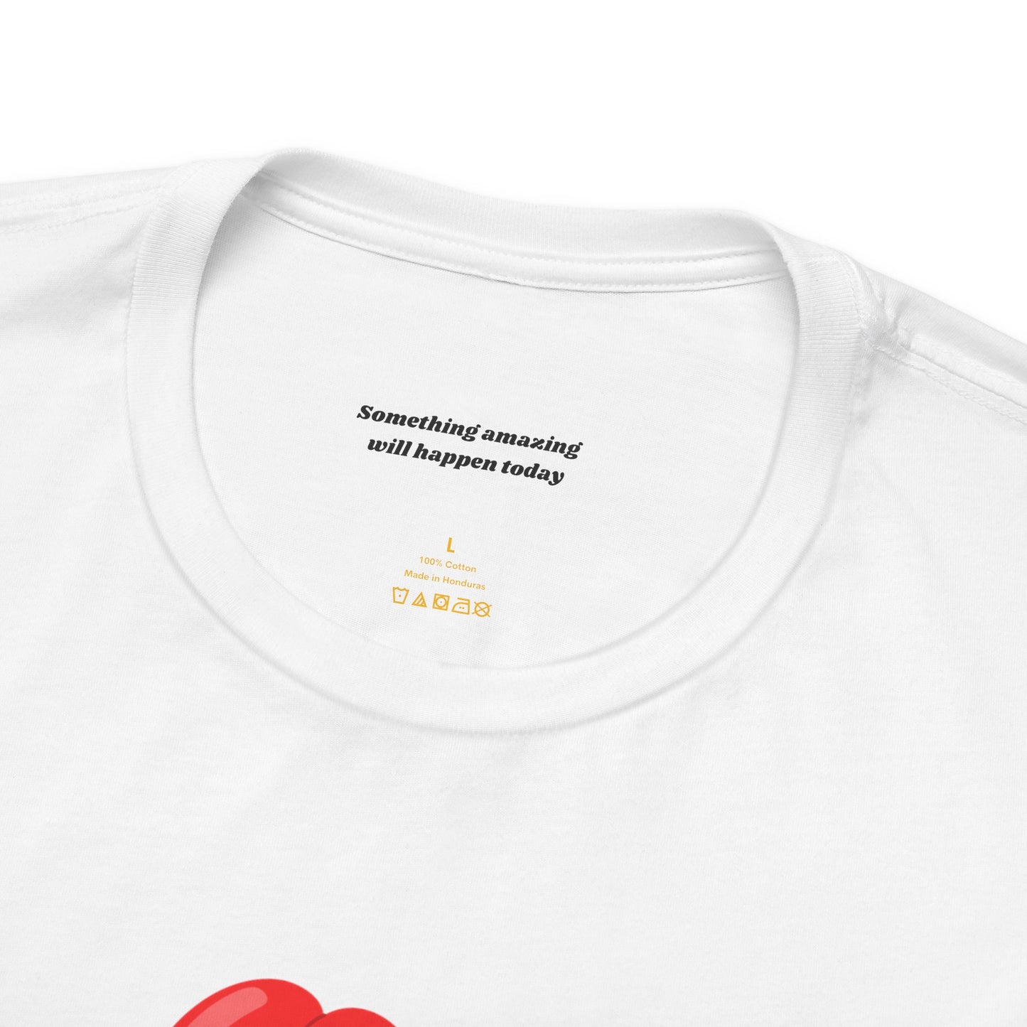 Close-up of neck label SOMETHING AMAZING WILL HAPPEN TODAY of red balloon animal dog graphic on white cotton tee - playful dog design 